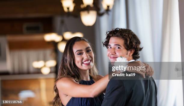 teenage couple dressed for prom, slow dancing - proms stock pictures, royalty-free photos & images