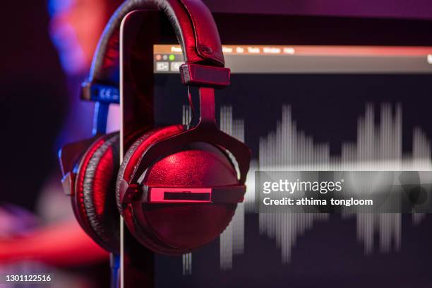 headphones in a home-studio audio recording and producing. - musica foto e immagini stock