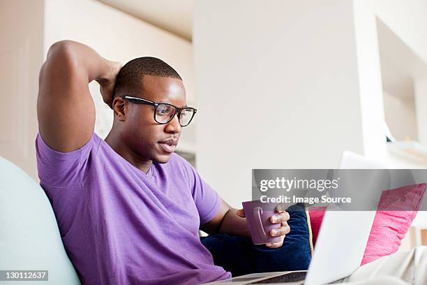 man using laptop - scratching head stock pictures, royalty-free photos & images