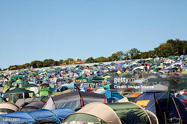 tents at summer music festival - music festival uk stock pictures, royalty-free photos & images