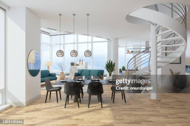 interior de la casa moderna de lujo con mesa de comedor, sillas, sala de estar y escalera de caracol. - spiral staircase fotografías e imágenes de stock