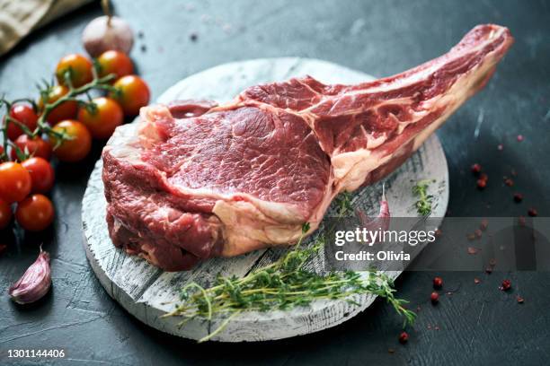 raw cowboy steak and
vegetables - tomahawk stock pictures, royalty-free photos & images