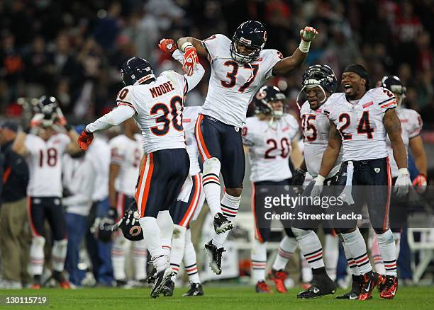 Moore of the Chicago Bears celebrates Anthony Walters of the Chicago Bears after he makes a game winning interception during the NFL International...