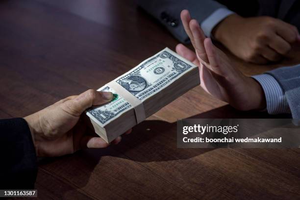businessman refusing money - anti bribery and corruption concepts,business corruption concept - bribery stock pictures, royalty-free photos & images