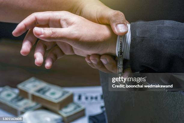 businessman arrested for fraud to the state - corruzione foto e immagini stock