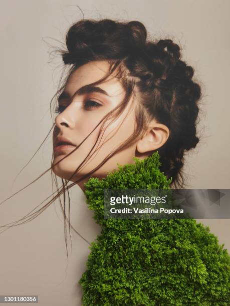 collage with female portrait and green plant - art modeling studio stock-fotos und bilder