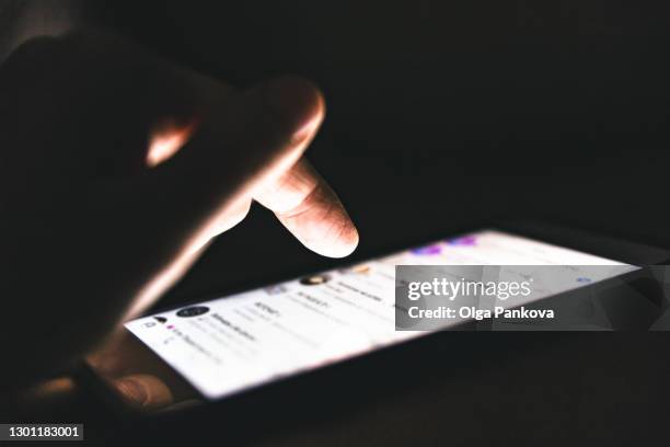 texting in the dark. use of gadgets. online communication. online shopping. virtual reality. - dating app photos et images de collection