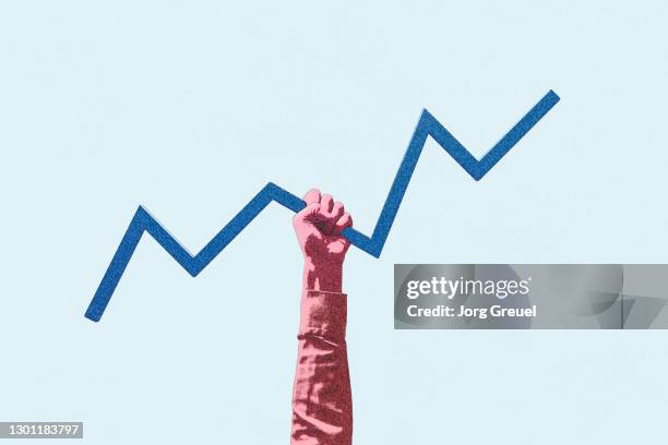 hand holding a line graph - liniendiagramm stock-fotos und bilder