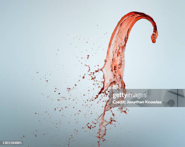 red wine splash - wine splash stock pictures, royalty-free photos & images