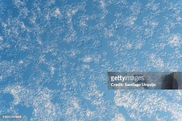 snow and ice on a window - january background stock-fotos und bilder
