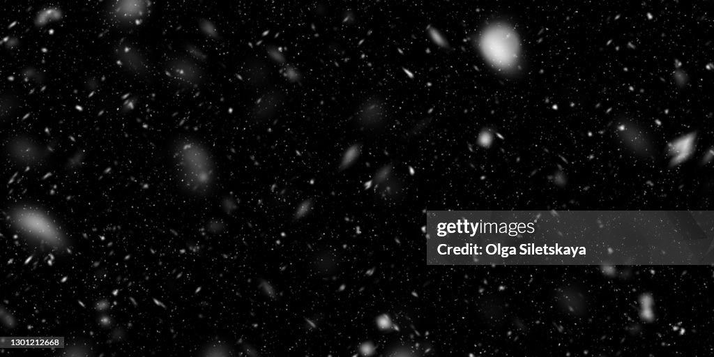 Falling snow on black background