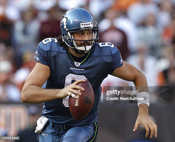 Quarterback Charlie Whitehurst of the Seattle Seahawks looks for a receiver against the Cleveland Browns at Cleveland Browns Stadium on October 23,...