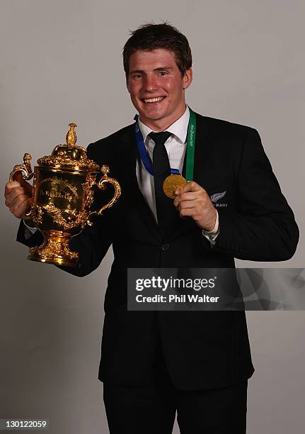 Colin Slade of the All Blacks poses with the Webb Ellis Cup after the 2011 IRB Rugby World Cup Final match between France and New Zealand at Eden...