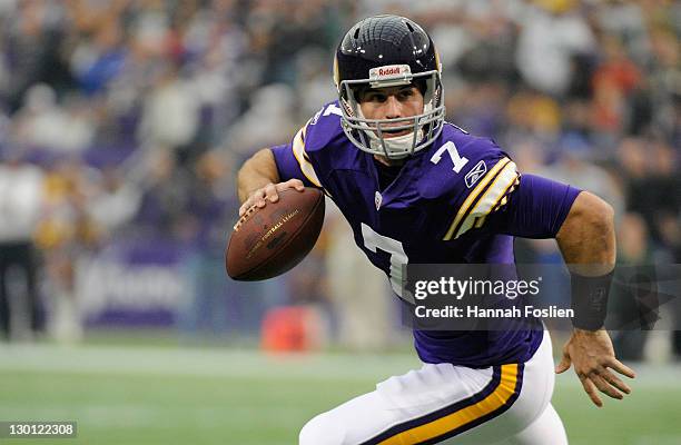 Christian Ponder of the Minnesota Vikings carries the ball against the Green Bay Packers in the first quarter on October 23, 2011 at Hubert H....