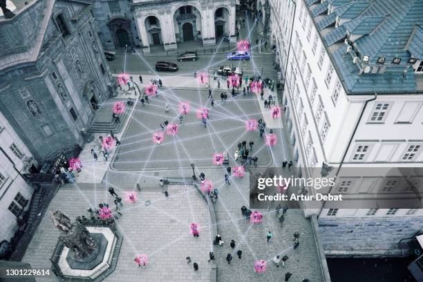 people in the street connected with blockchain system, the future of communication. - prague people stock pictures, royalty-free photos & images