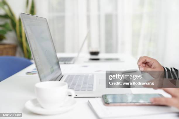 laptop on desk conference table in board room - hand white background stock pictures, royalty-free photos & images