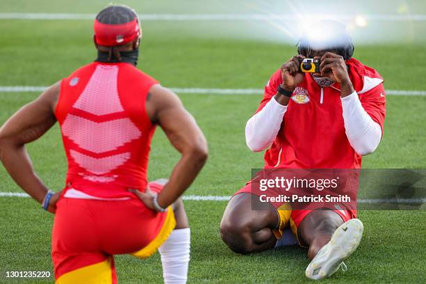 Tanoh Kpassagnon of the Kansas City Chiefs uses a disposable camera to take a picture of Dorian O'Daniel before Super Bowl LV against the Tampa Bay...