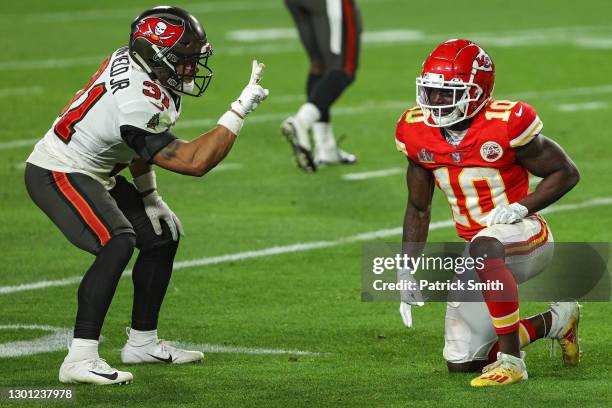 Antoine Winfield Jr. #31 of the Tampa Bay Buccaneers gestures towards Tyreek Hill of the Kansas City Chiefs after breaking up a pass during the...