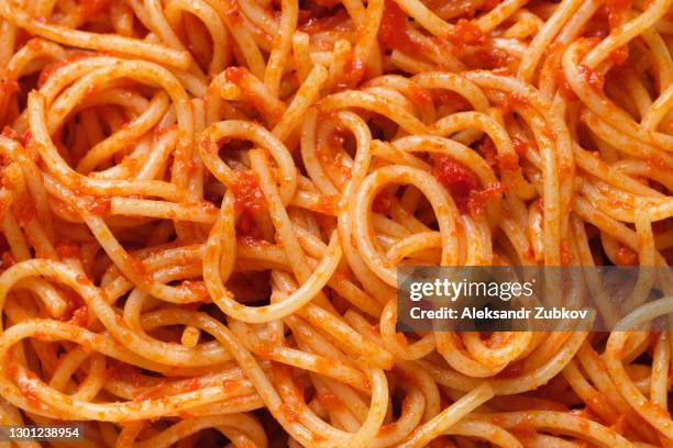 spaghetti or pasta bolognese in tomato sauce on a ceramic plate, on a white background or table. the concept of vegetarian and vegan food. food background. - molho bolonhesa imagens e fotografias de stock