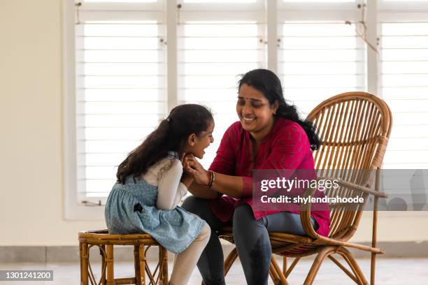 mother and daughter playing at home - bangalore stock pictures, royalty-free photos & images