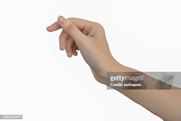 a close up of a woman's hand on a white background - hands holding photos et images de collection