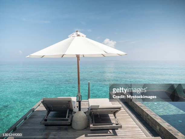 private overwater villa in the maldives - private island stock pictures, royalty-free photos & images