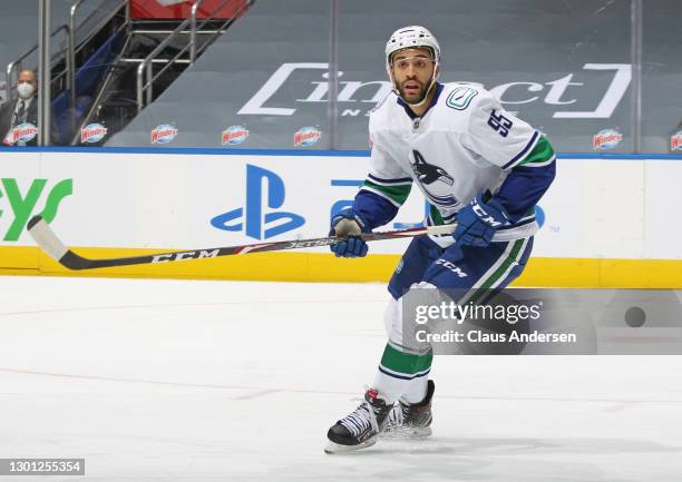 Justin Bailey of the Vancouver Canucks skates against the Toronto Maple Leafs during an NHL game at Scotiabank Arena on February 8, 2021 in Toronto,...