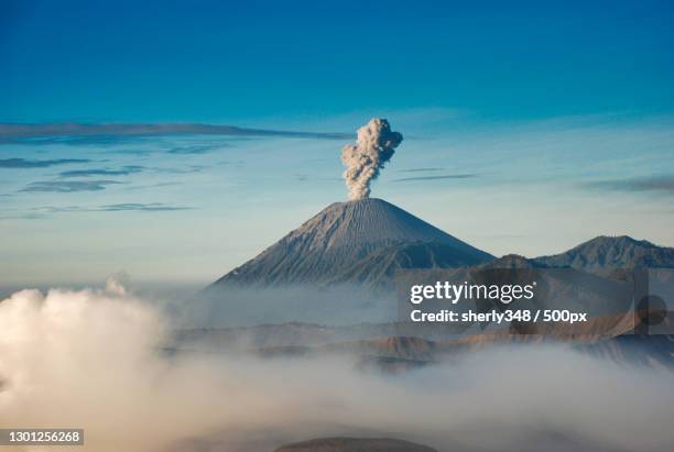 view of volcanic landscape against blue sky,semeru,indonesia - mt semeru stock pictures, royalty-free photos & images