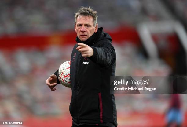 Stuart Pearce, Assistant Manager of West Ham United watches over the warm up prior to The Emirates FA Cup Fifth Round match between Manchester United...
