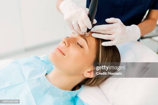dermapen skin needling treatment on a patient skin - mesotherapy stock pictures, royalty-free photos & images