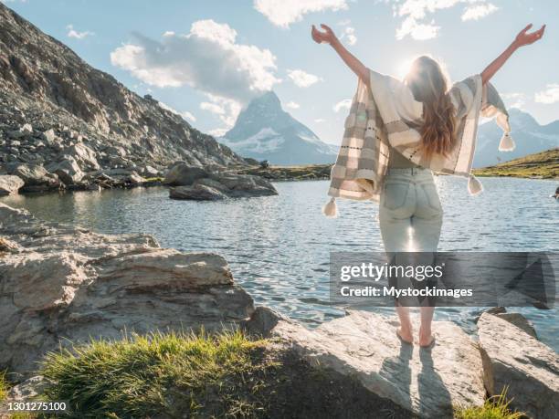 woman explores freedom in nature - valais canton stock pictures, royalty-free photos & images