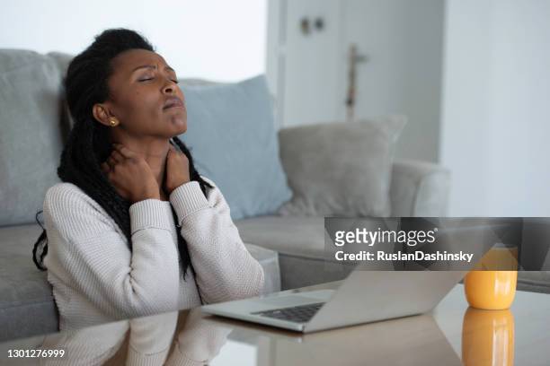 woman working home online, feeling stressed. - reduce stock pictures, royalty-free photos & images