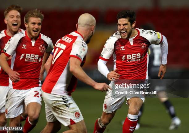 Danny Andrew of Fleetwood Town celebrates with teammates after scoring their team's third goal during the Sky Bet League One match between Fleetwood...