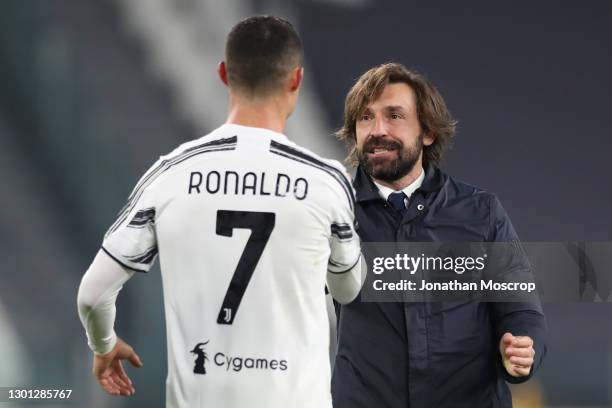 Andrea Pirlo Head coach of Juventus embraces Cristiano Ronaldo of Juventus following the final whistle in the Coppa Italia semi-final between...