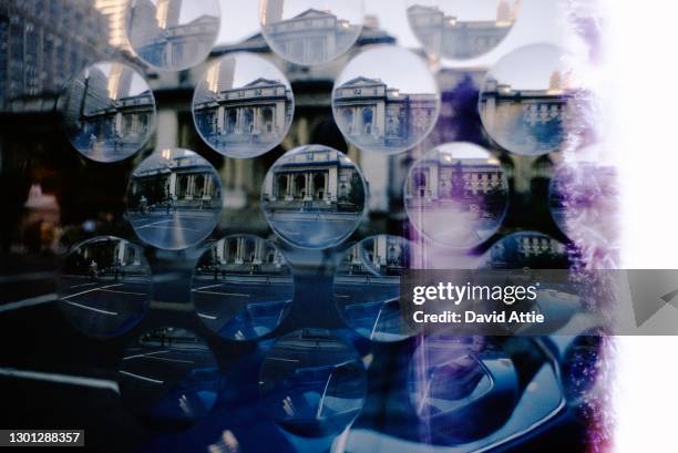 Distorted image of the Main Branch of the New York Public Library, also known as the Stephen A. Schwarzman Building, at 476 Fifth Avenue, through a...