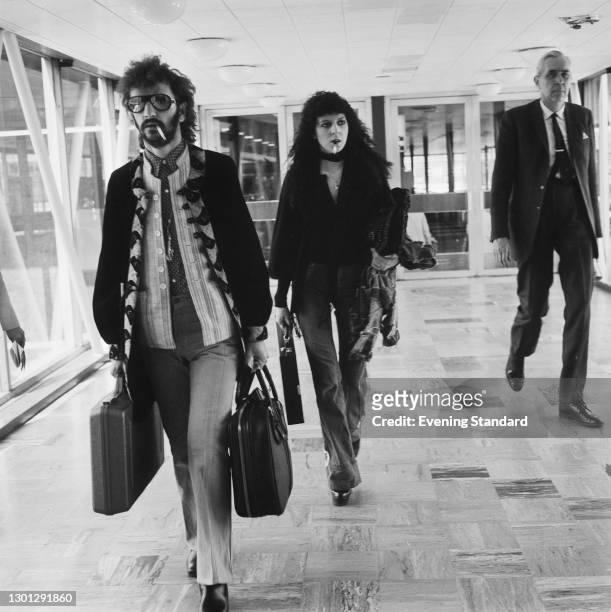English drummer Ringo Starr , formerly of the Beatles, at Heathrow Airport in London with his wife Maureen, UK, 18th May 1973.