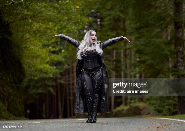 woman in vampire costume outdoors. - crazy holiday models stock-fotos und bilder