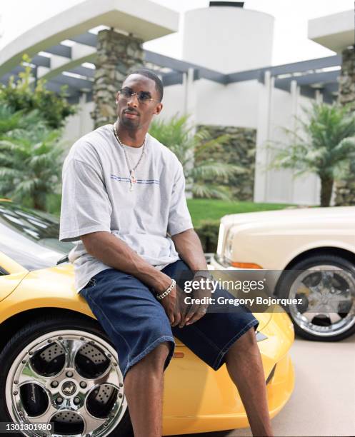 Superstar, Kobe Bryant poses with his Bentley and Lamborghini on September 8th, 2002 in Beverly Hills, California.