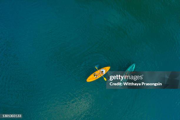 aerial image of kayak in lake tahoe - two people canoeing on a lake stock pictures, royalty-free photos & images