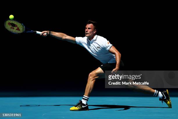 Marton Fucsovics of Hungary plays a forehand in his Men's Singles second round match against Stan Wawrinka of Switzerland during day three of the...
