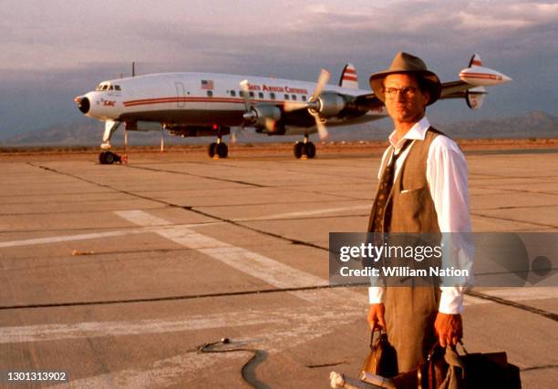 American actor, playwright, author, screenwriter, and director Sam Shepard stands on the set of the 1991 English-language drama film "Voyager" circa...