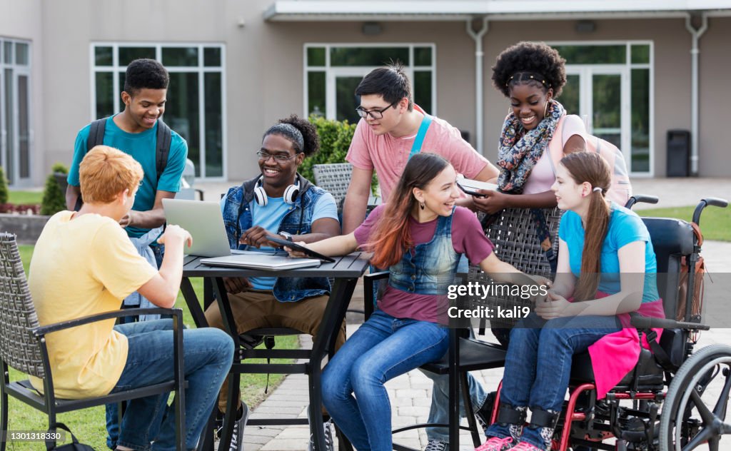High school students studying outdoors