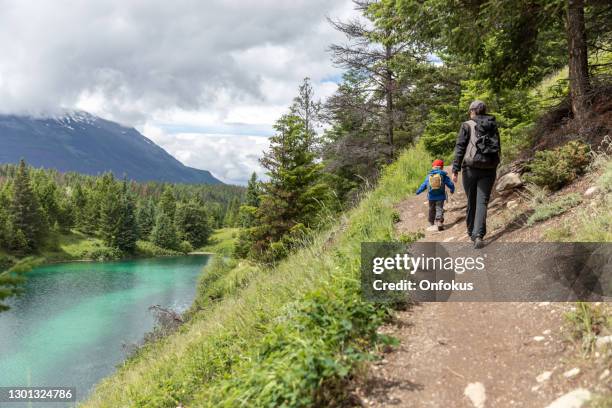 monther and son hiking at five lakes in jasper national park, canada - jasper stock pictures, royalty-free photos & images