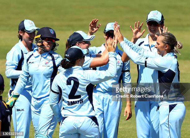 Ashleigh Gardner of the NSW Breakers celebrates taking the wicket of Sophie Molineux of Victoria during the WNCL match between Victoria and New South...