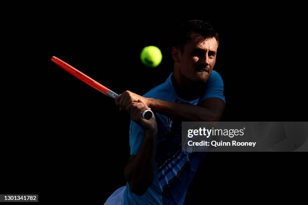 Bernard Tomic of Australia plays a backhand in his Men's Singles second round match against Denis Shapovalov of Canada during day three of the 2021...