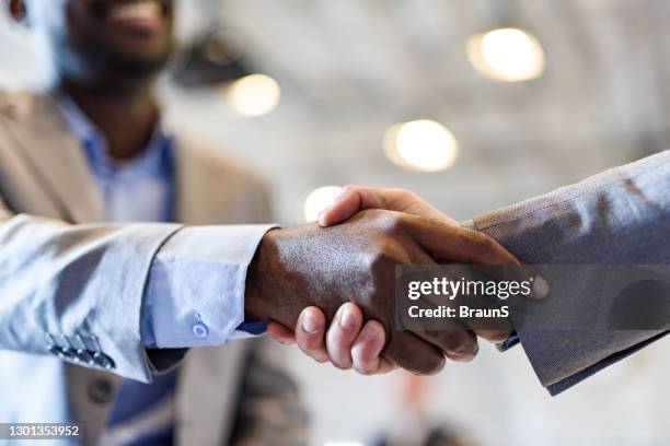 we have a deal! - black men shaking stock pictures, royalty-free photos & images