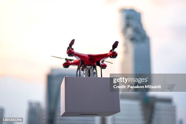 unmanned aerial vehicle (uav) technology, known as drones, is one of the innovations that not only facilitate but also increase the efficiency of product transportation - delivery drone stock pictures, royalty-free photos & images