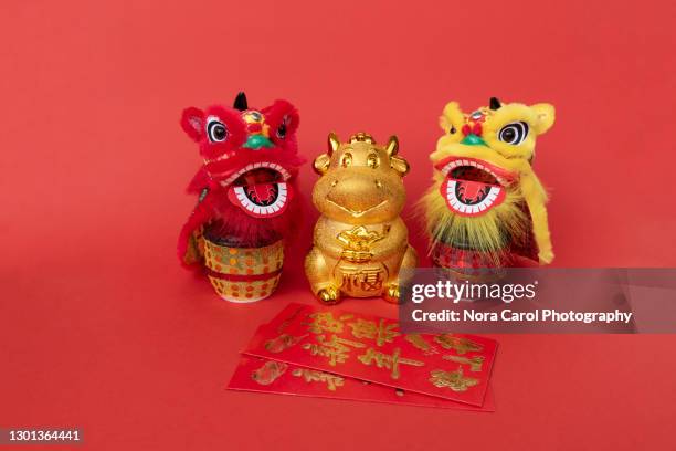 year of ox chinese new year concept with two lion dance head - asian ox stockfoto's en -beelden