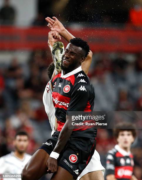 Bernie Ibini of the Wanderers is fouled by Rudy Gestede of the Victory in the box during the A-League match between the Western Sydney Wanderers and...