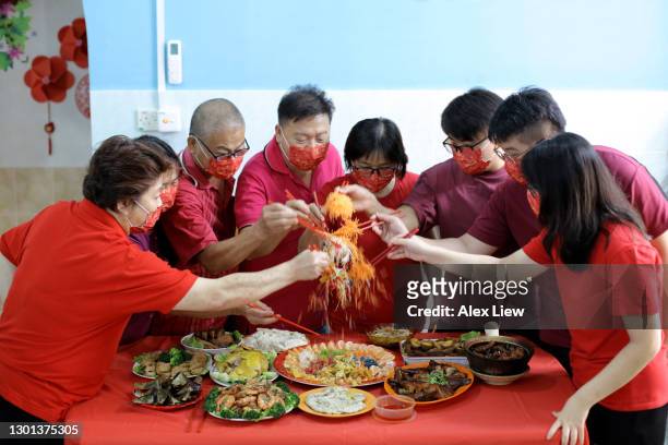 lou sang (prosperity toss) - prosperity toss stock pictures, royalty-free photos & images